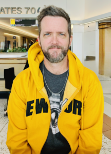 Will Chatham in an airport, 2023.